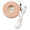 Round wooden base with light