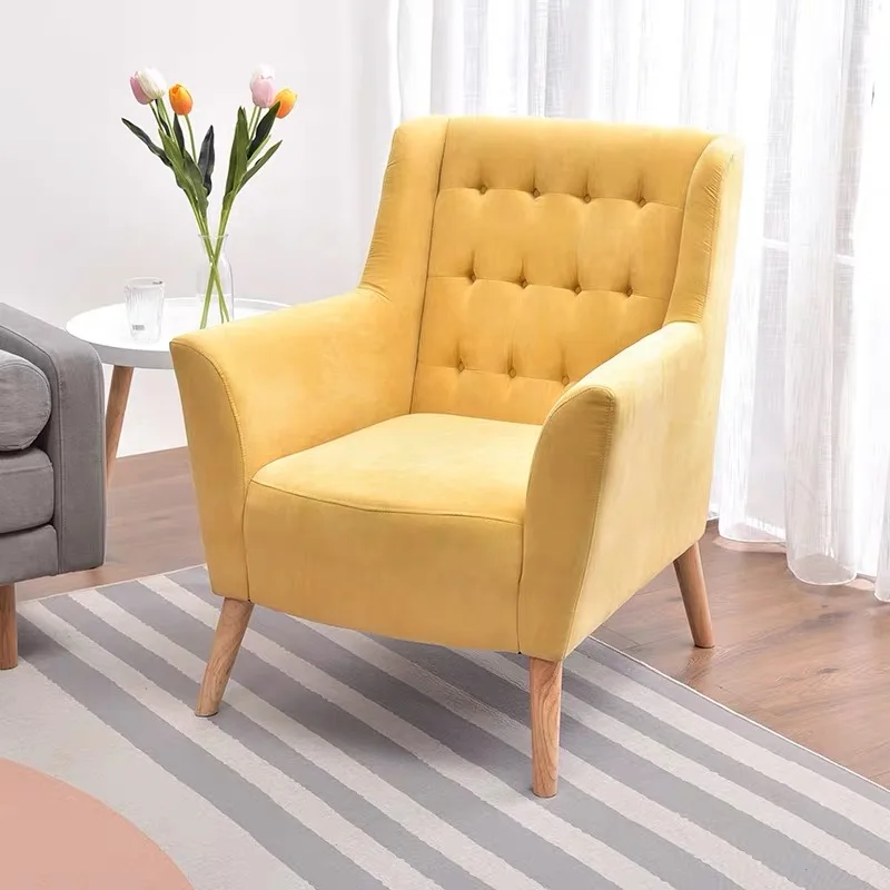 yellow fabric armchairs