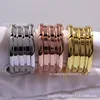 Three-ring gold-colored spring