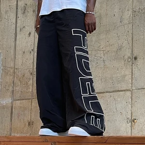 Supplier Oem Fashion Streetwear Vintage Track Pants Men  logo Printed Sportswear Oversized Fit Wide Leg Baggy Nylon Pants