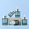 Spraying green bottles
