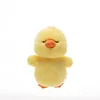 Canard jaune couché sur le dos