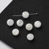 Perles de lettres en coquillage -- T