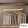 8 percheros dorados para pantalones