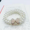 white pearl knot-gold