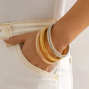 OEM Vintage Gold Plated Stainless Steel Snake Bone Striped Elastic Bracelet Fashionable Chunky Bracelet for Couples Trendy Style