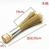 Light-colored wood-steel handle brush