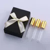 Bouteille transparente avec pulvérisateur d'or + boîte cadeau