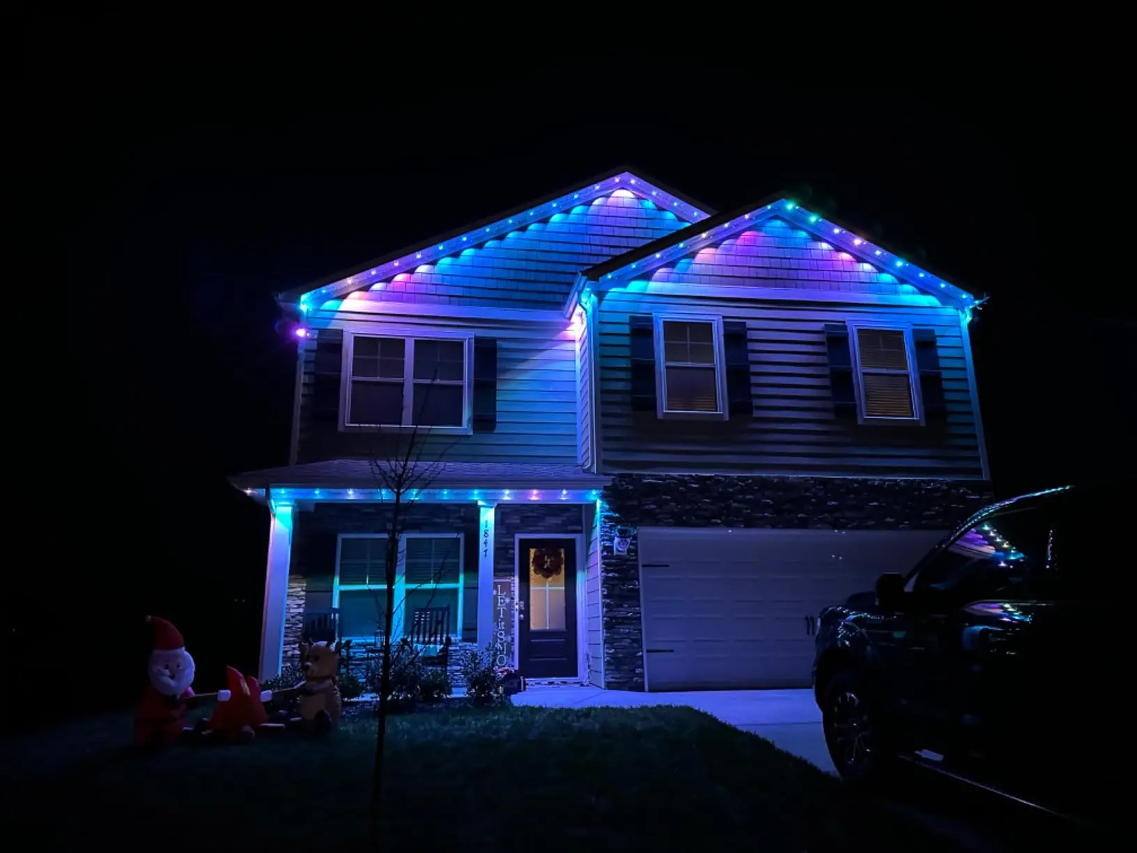 House at night with EverGlow Christmas red and green LED lights