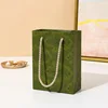 bolsa de papel verde
