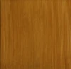 Ottone lucidato a specchio con tonalità marrone tendente al giallo.