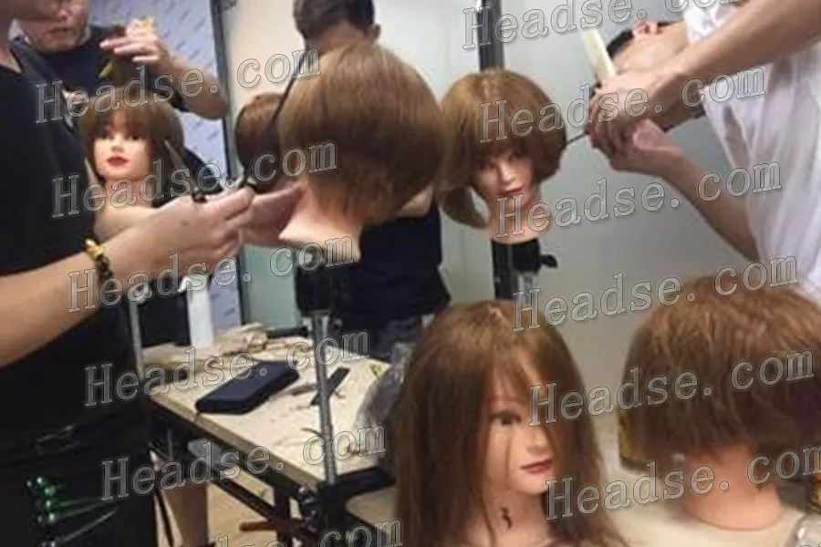 Beginners practice basic cutting techniques head model