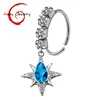 Silver star with blue stone