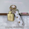Perfume bottle (containing 20mg of gold - white cord)