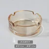 Amber glass ashtray