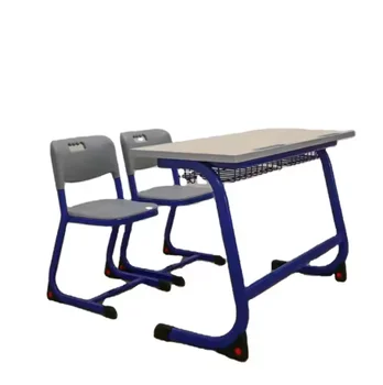 Deluxe fixed double desk and chair for use in school meeting rooms