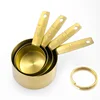 Golden set of four measuring cups