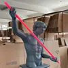 Dark gray half-body david figure + red light tube