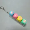 Four-button transparent shell - silicone cat paw design in blue, pink, yellow, and green.