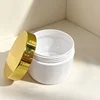 White bottle with gold lid