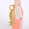 ouvre-bouteille doré - forme d'ananas