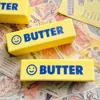 Bâton de beurre Smiley jaune (sac PE)