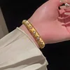 5 bracciali - oro - fiori - placcatura in oro vero