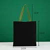 Bolso tote verde de 21*23 con asa de lona negra.