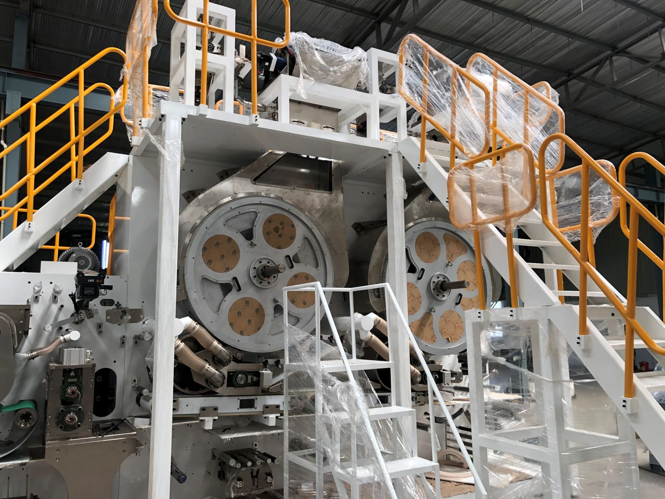 WellDone New Condition Semi-Servo Laminating Adult Urine Pants Production Machine Good Supplier Adult Diaper Making Machine