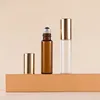 Clear bottle + steel roller ball + gold aluminum cap