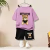 Grande orso dorato#Maglietta viola a maniche corte + shorts neri