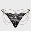 Black thong with purple rhinestone