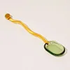 Cucchiaio verde da 16 cm con manico ambrato