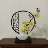 Vertical screen, small white teapot, yellow plum blossom