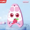 Pink rabbit holding carrot