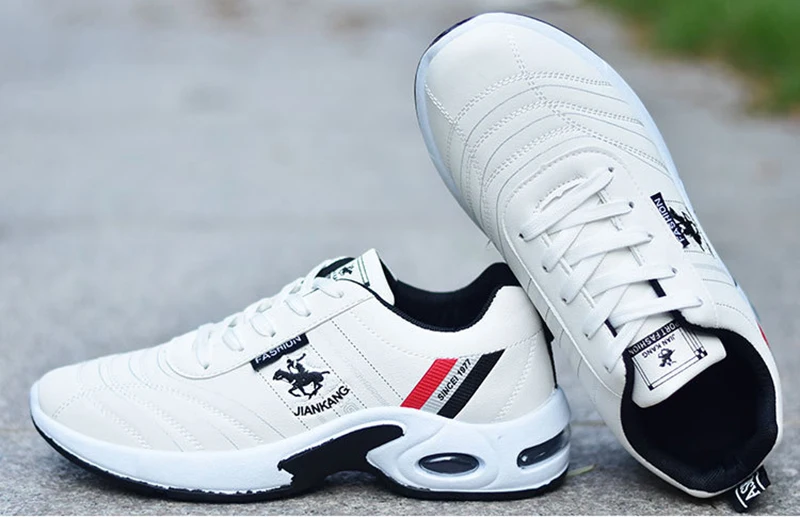 white sport shoes pair