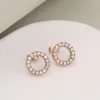 Rose gold and white rhinestone earrings