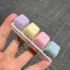 Four-button white shell - light purple, light yellow, light pink and gray