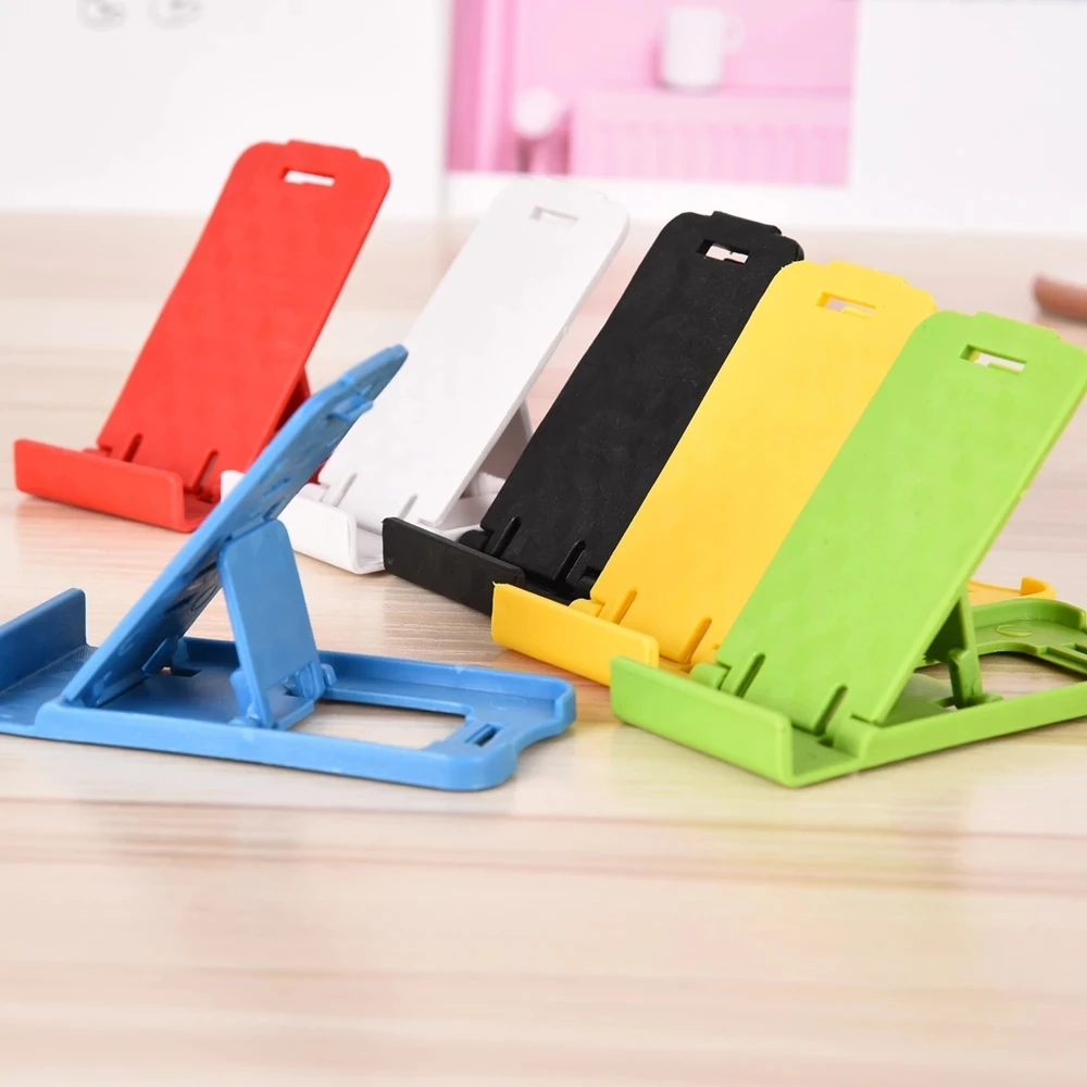 Foldable universal adjustable mobile phone holder