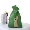A handbag with a rabbit