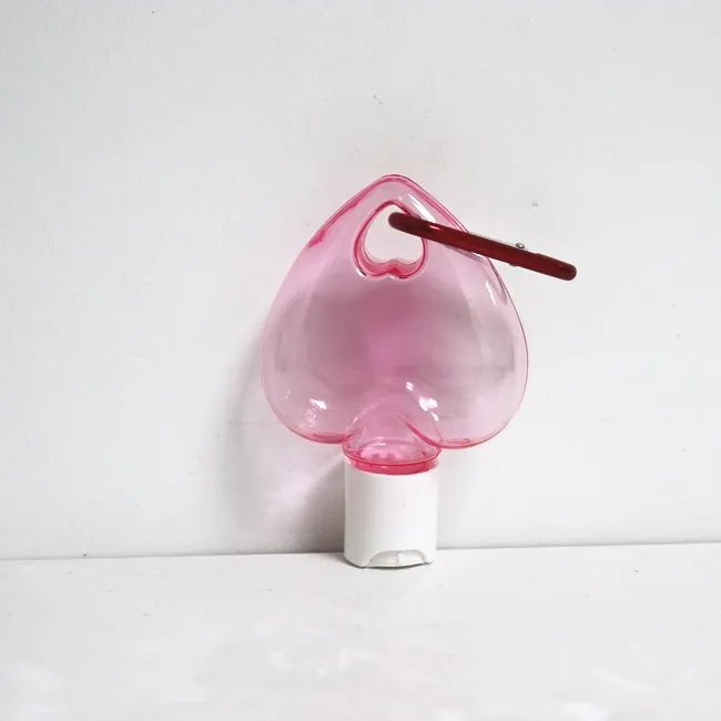 2025 Custom PETG Heart Shape Empty Hand Sanitizer Bottle with Hook 50ml Plastic Gel Bottle with Keychain