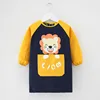 Long-sleeve apron with hidden yellow lion