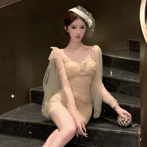 Long Sleeve Mesh Bodycon Mini Dress with Hand-Embellished Crystals & Bow Tie Detail Smocked Evening Gown Trend 2025