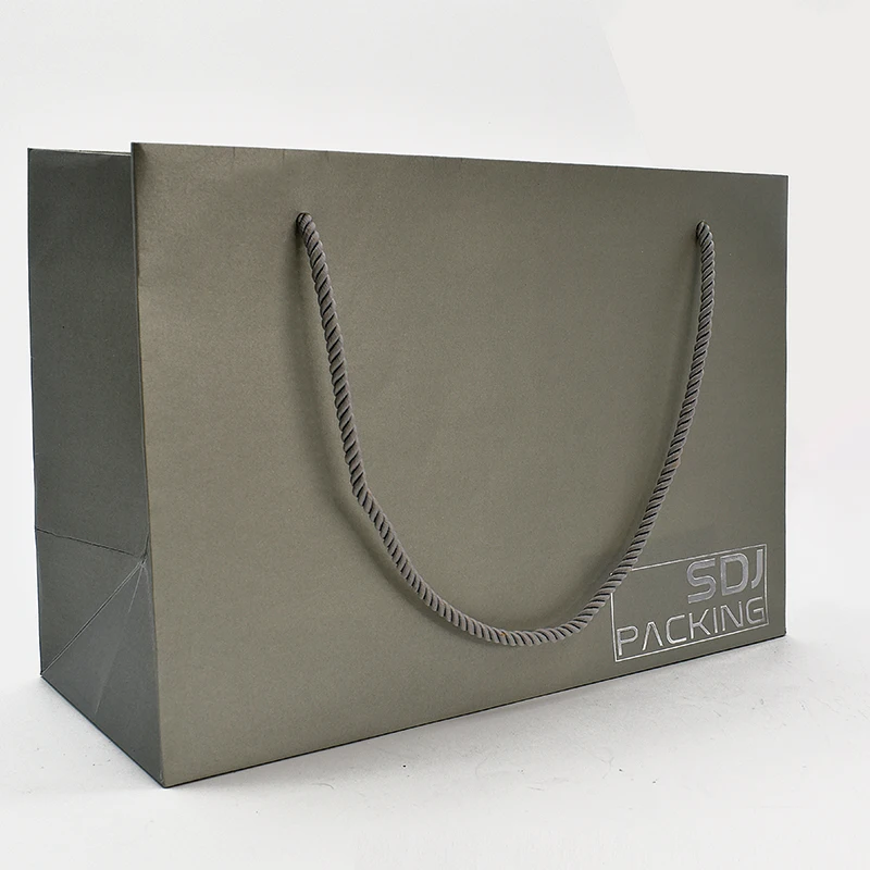Customized Luxury Premium Gift Bag with Exquisite Embossing Sponge Lining UV Coating Matt Lamination manufacture