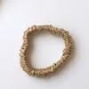 gold silk scrunchies