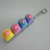 Four-button transparent shell - silicone cat paw (purple, blue, pink, yellow)