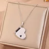 Black- heart book necklace