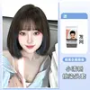 Ear loop hair dyed brown-black with blue highlights