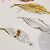 Single gold edged glass feather, size 25cm