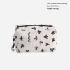 Bolsa almohada con lazo blanco y negro.